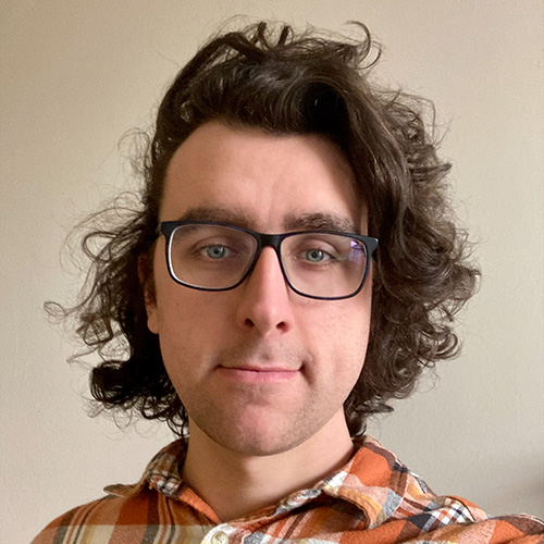 Headshot portrait of Daniel MacGregor